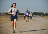 Quality running shoes & sunglasses if you are running at dawn. (Image via Pexels / Pixabay)